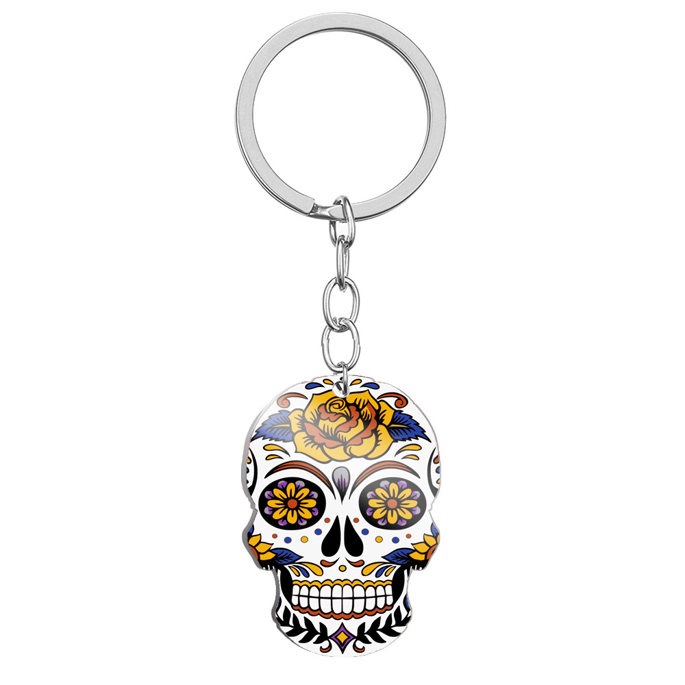 8ASST VOODOO SKULL KEY CHAINS 12PCS ON HANGER